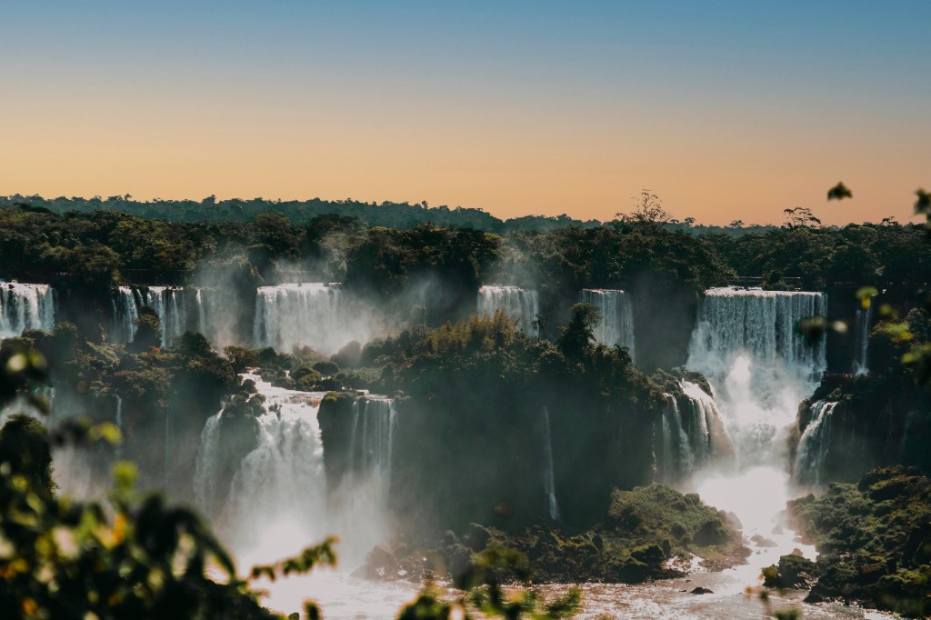 Iguazú Falls with a rainbow over the cascades