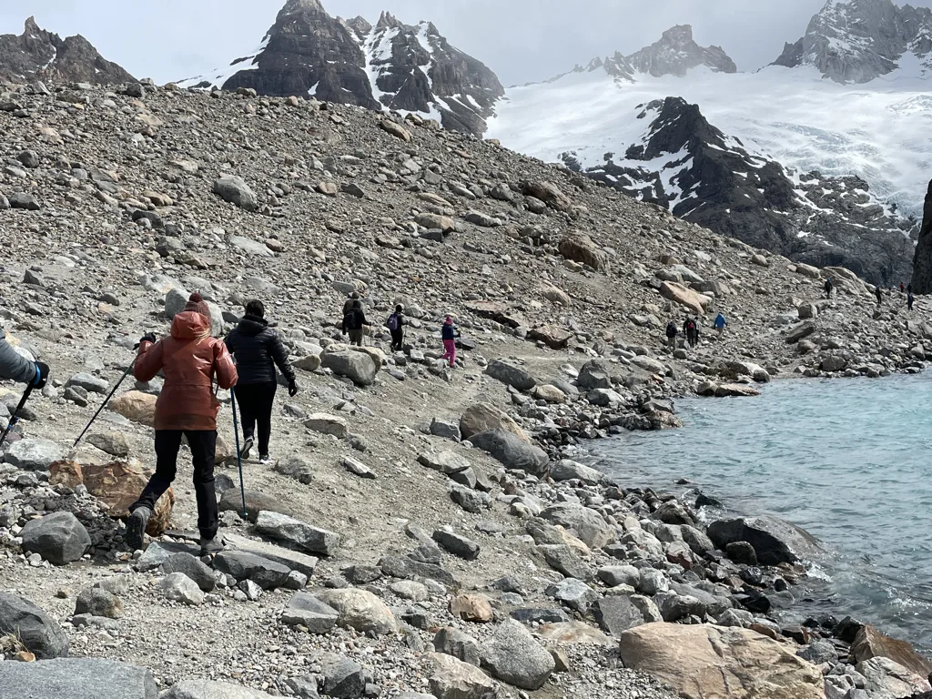 Hikers crossing the rocky final ascent to Laguna de los Tres