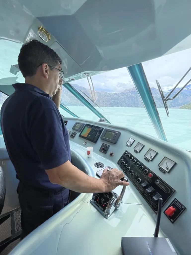 The captain navigating across Lake Argentino