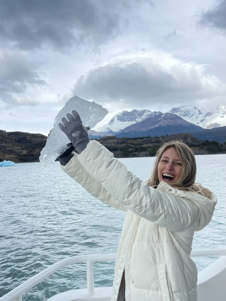 A traveler holding a piece of ancient glacial ice