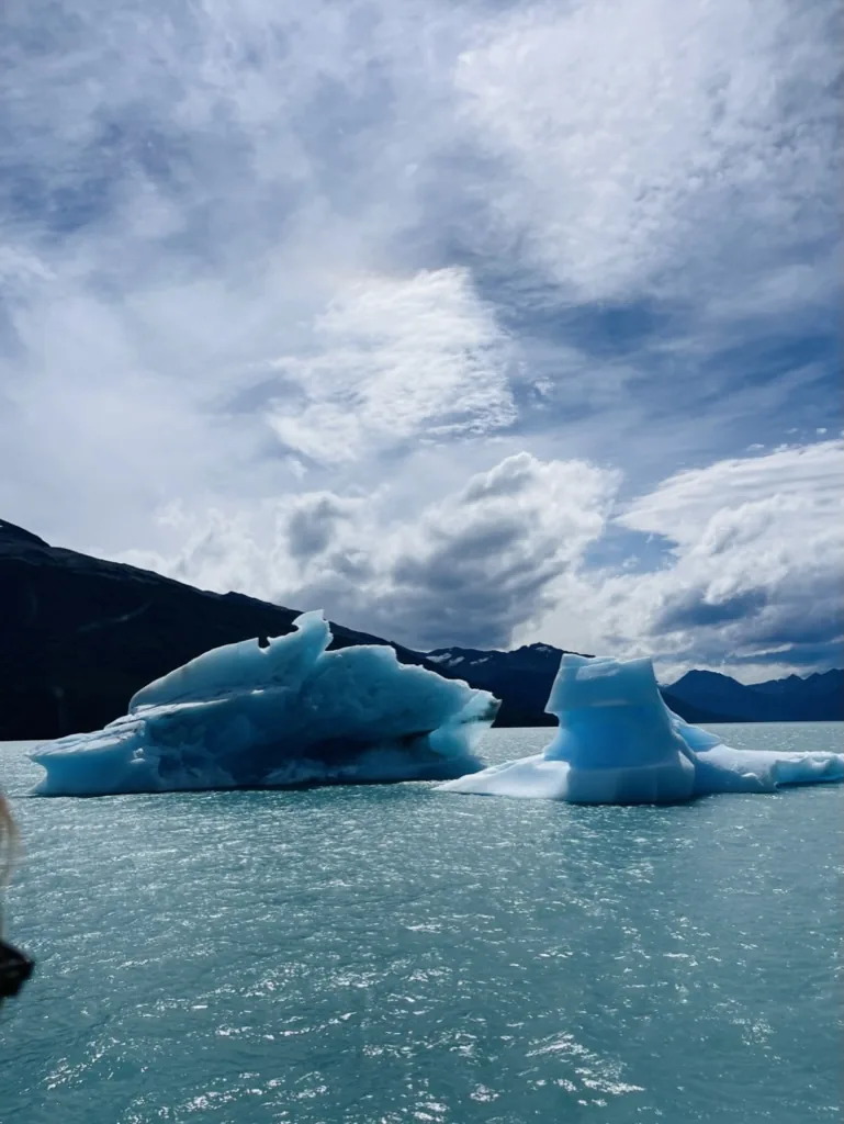 Deep blue icebergs floating across Lake Argentino